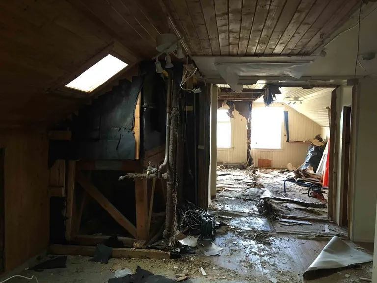 A worn, stripped-back room at Nøsen before the renovation