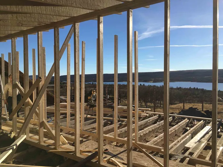 New timber framing inside, opening onto the lake and mountains